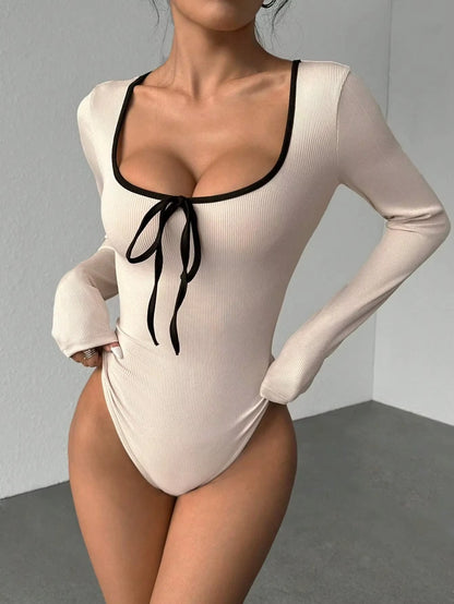 Beige U neck bodysuit with black bowknot and long sleeves, color block design — view 12 — view 12