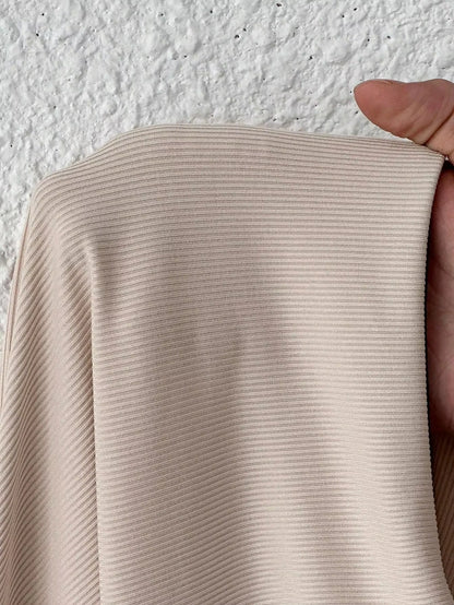 Close up of beige ribbed fabric from bodysuit, showcasing texture and detail — view 13 — view 13