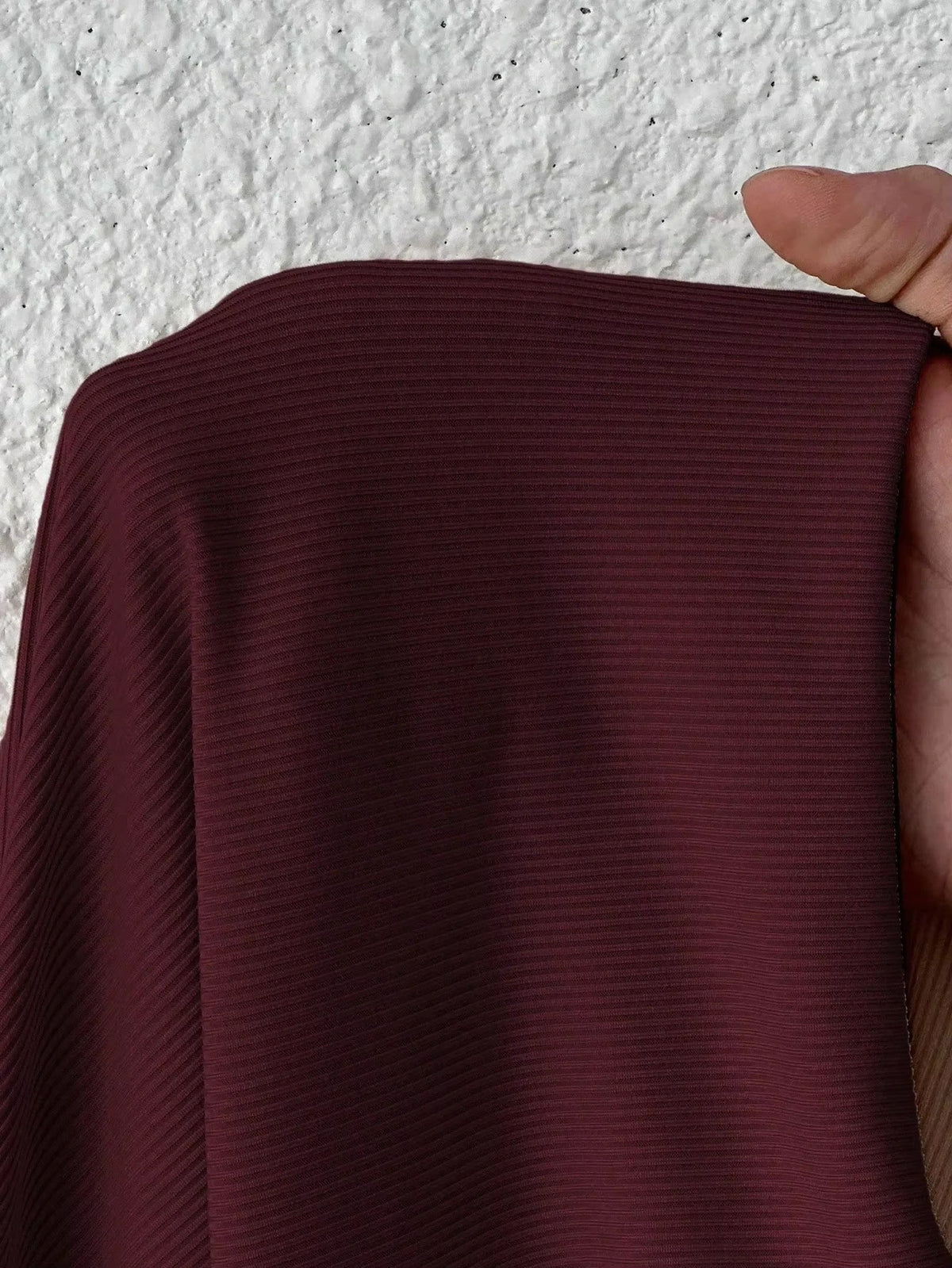 Bodysuit — Maroon fabric with subtle ribbed texture, close up view — 18 — view 18