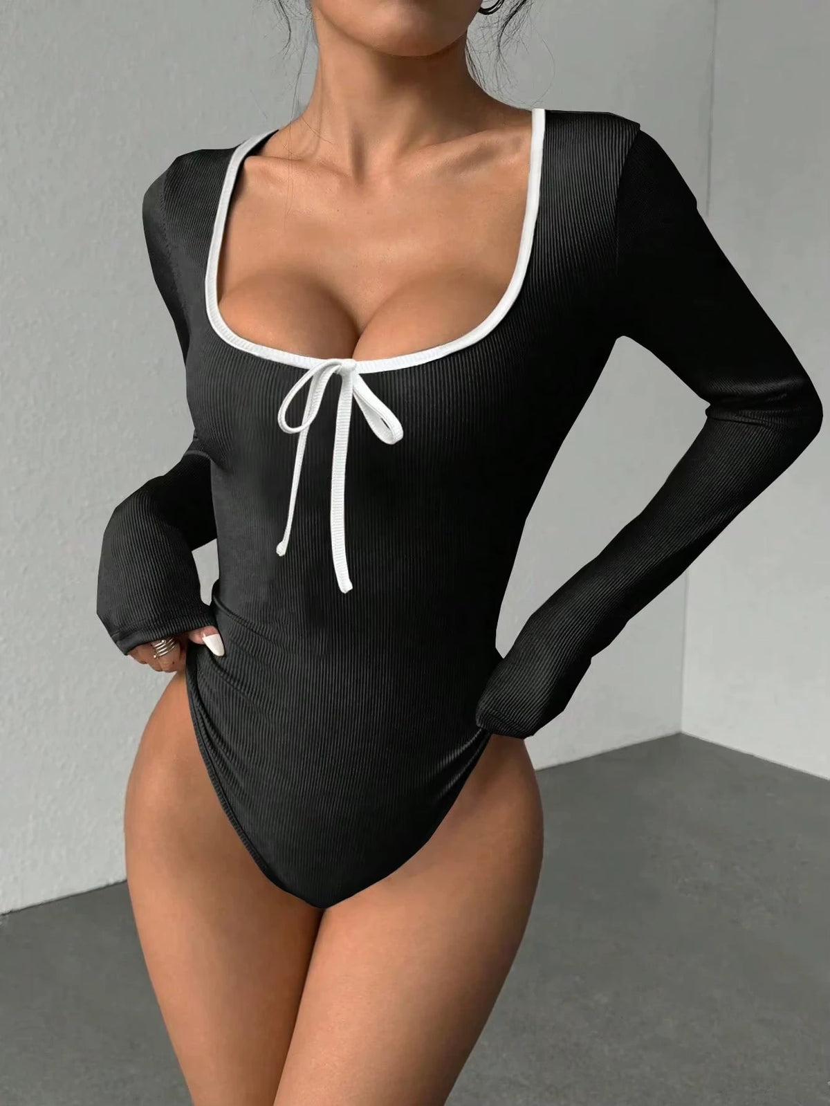 Black long sleeve bodysuit with U neck and bowknot detail, color block design — view 5 — view 5