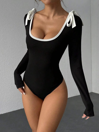 Black rib knit long sleeve bodysuit with white bow accents on shoulders — view 10 — view 10