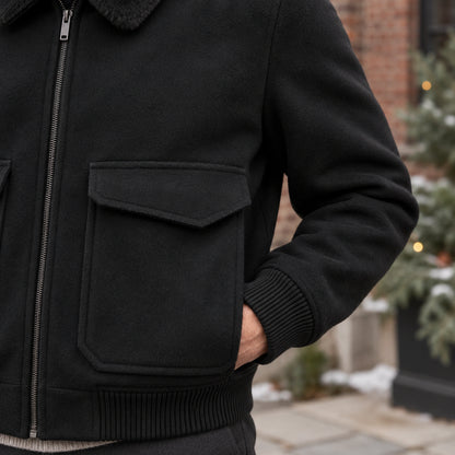 Men's Faux Fur Collar Bomber Jacket — Noah — Black — close up of one pointed flap on the large front patch pocket — view 9