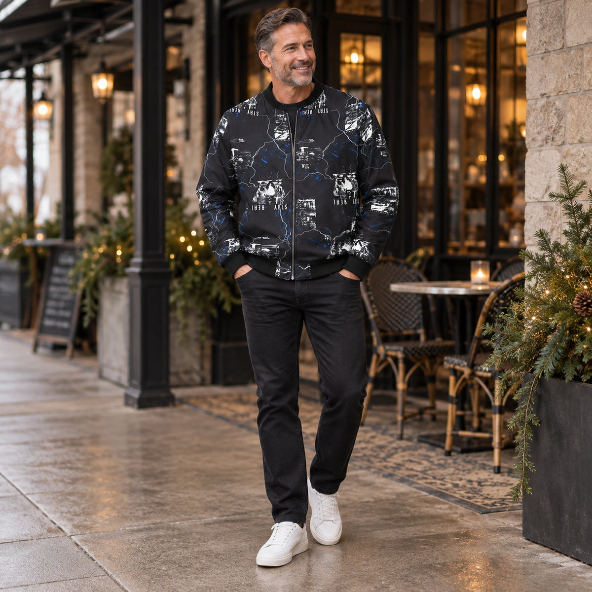 Men's Graphic Print Bomber Jacket — Enzo — Black and Blue — full outfit while standing naturally by a sheltered — view 13