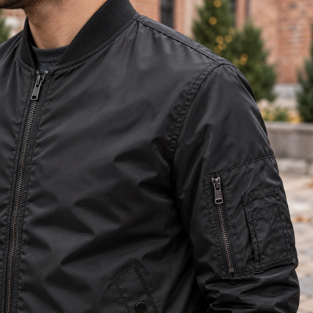 Men's Lightweight Utility Bomber Jacket — Hector — Black — close up of the shell texture and shoulder seam — view 18