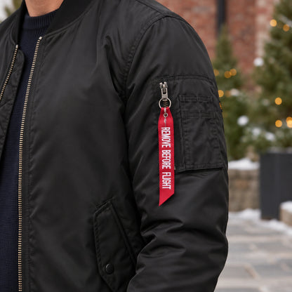 Men's Zip Front Bomber Jacket — Joey — Black — close up of the left sleeve utility pocket and original red tag — view 9