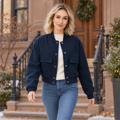 Women's Snap Front Pocket Bomber Jacket — Mira — Navy — complete garment in a gentle walking pose toward camera — view 6