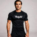 View of a fitted black athletic compression running tee made from moisture wicking fabric with short sleeves