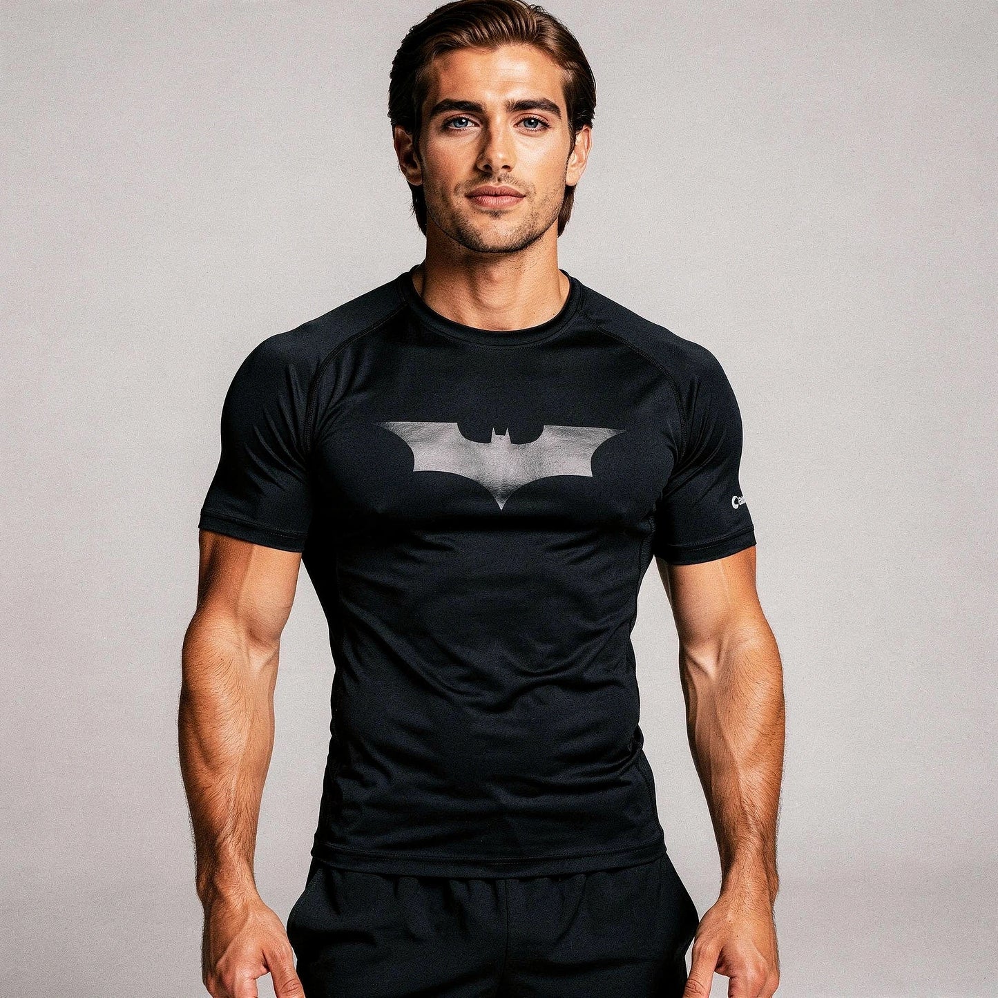 View of a fitted black athletic compression running tee made from moisture wicking fabric with short sleeves