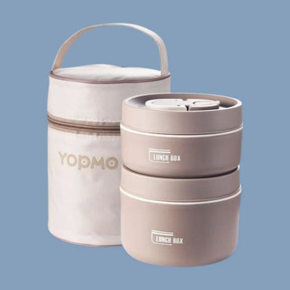 View of a chic insulated meal container set in a vibrant teal color, featuring a secure lid and sleek design for on the go dining