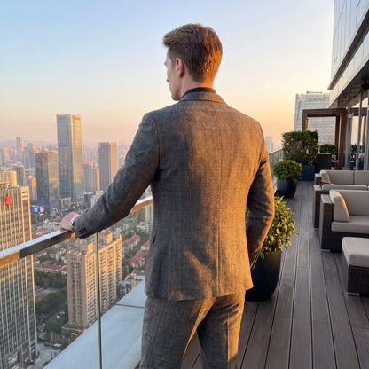 Close up view showing the high quality modified plaid fabric and precise stitching details of the British Korean style three piece suit for men.