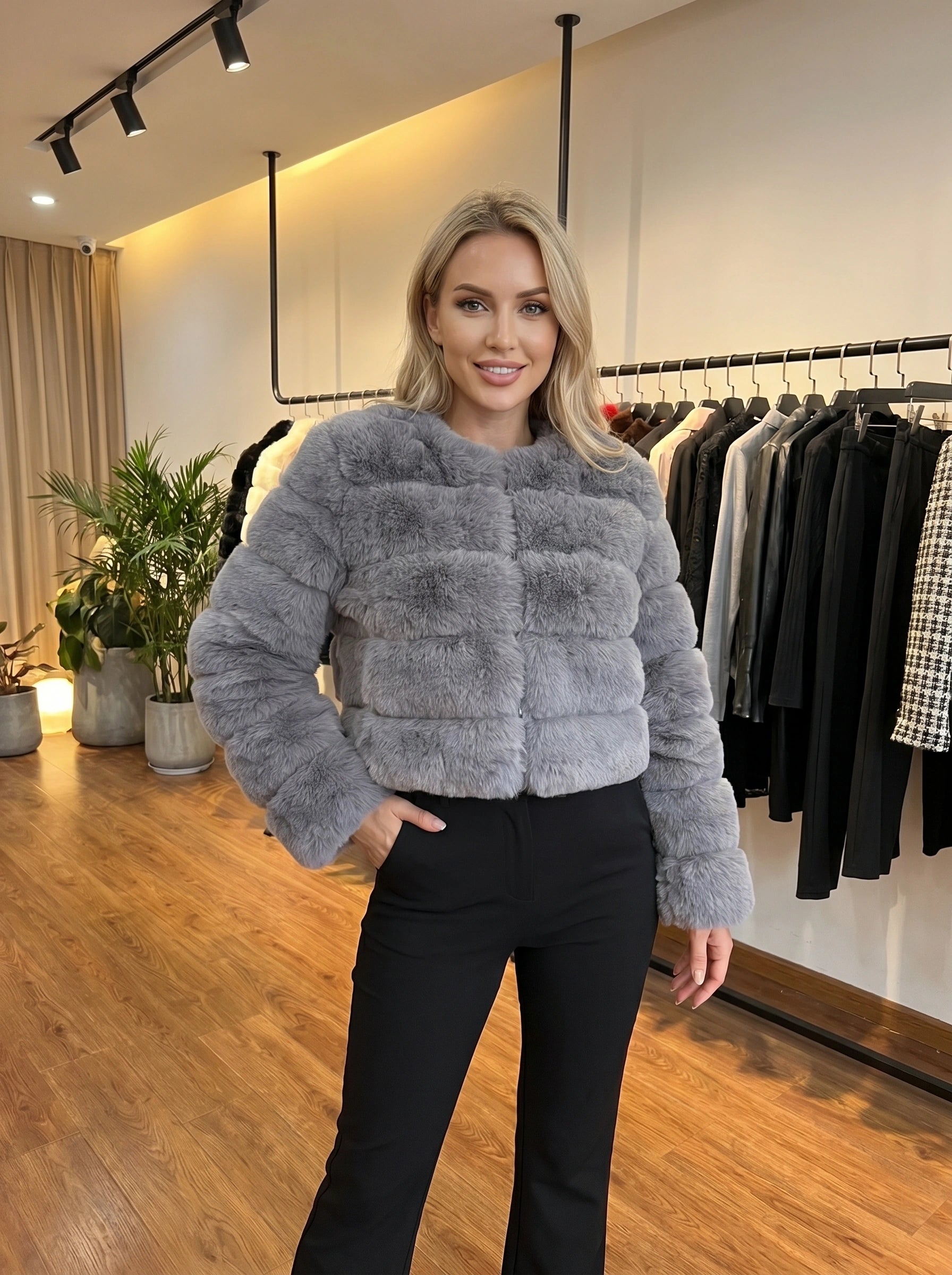 Close up view of the Womens Fluffy Autumn Coat showing its luxurious fabric texture, intricate stitching, and design details against a soft, neutral background.