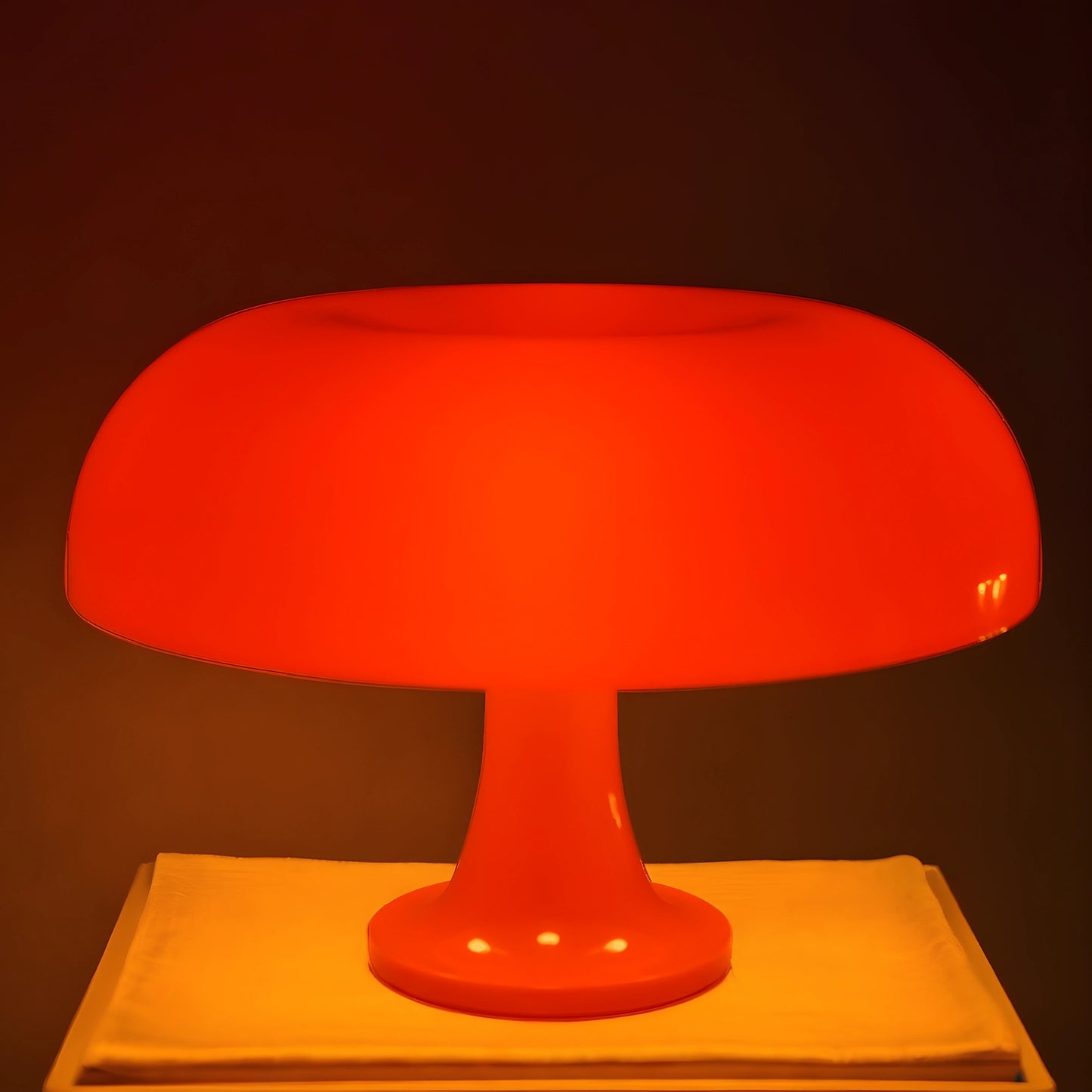 View of a contemporary sculpted acrylic mushroom table lamp in a translucent white finish with a smooth, rounded shape