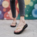 Lightweight flat beach sandals for women in vibrant coral, featuring adjustable straps and a cushioned footbed, view