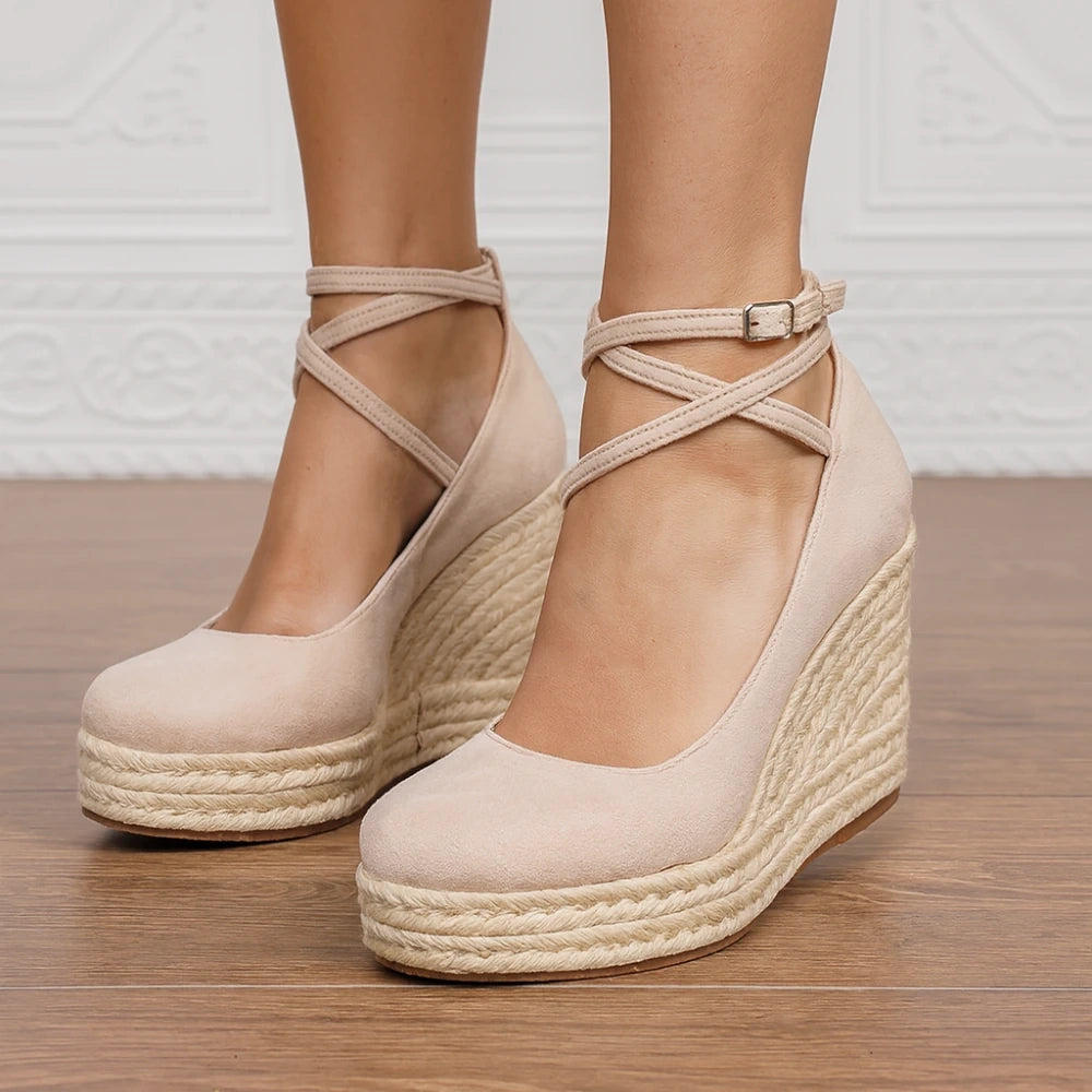 View of elegant women's summer sandals in soft beige leather with adjustable ankle straps and cushioned footbed