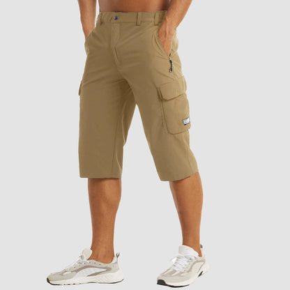 View of khaki cargo shorts featuring multiple pockets, structured design, and lightweight fabric, perfect for summer wear
