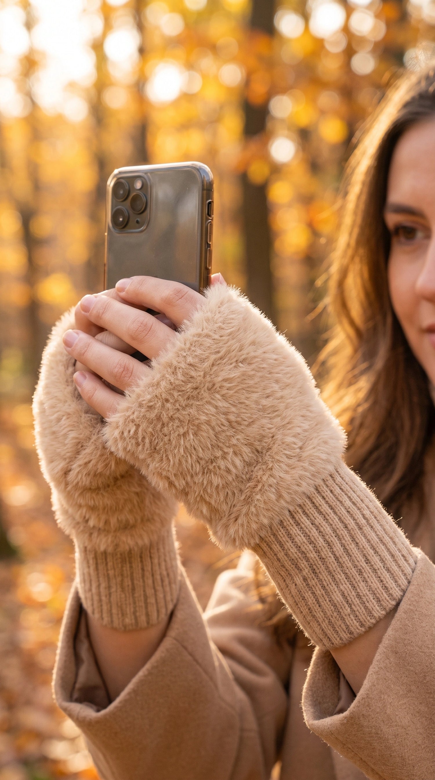 Model showcases women's cozy protective autumn gloves in a rich burgundy color, paired with a high waisted coat against a neutral backdrop.