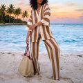 Model showing the Womens Airy Boho Summer Beach Set in a light pastel color, showing a flowy blouse and matching shorts against a sunny beach backdrop.