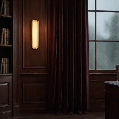 Elegant alabaster wall sconce featuring a sculptural design, soft ambient light, and a detailed view