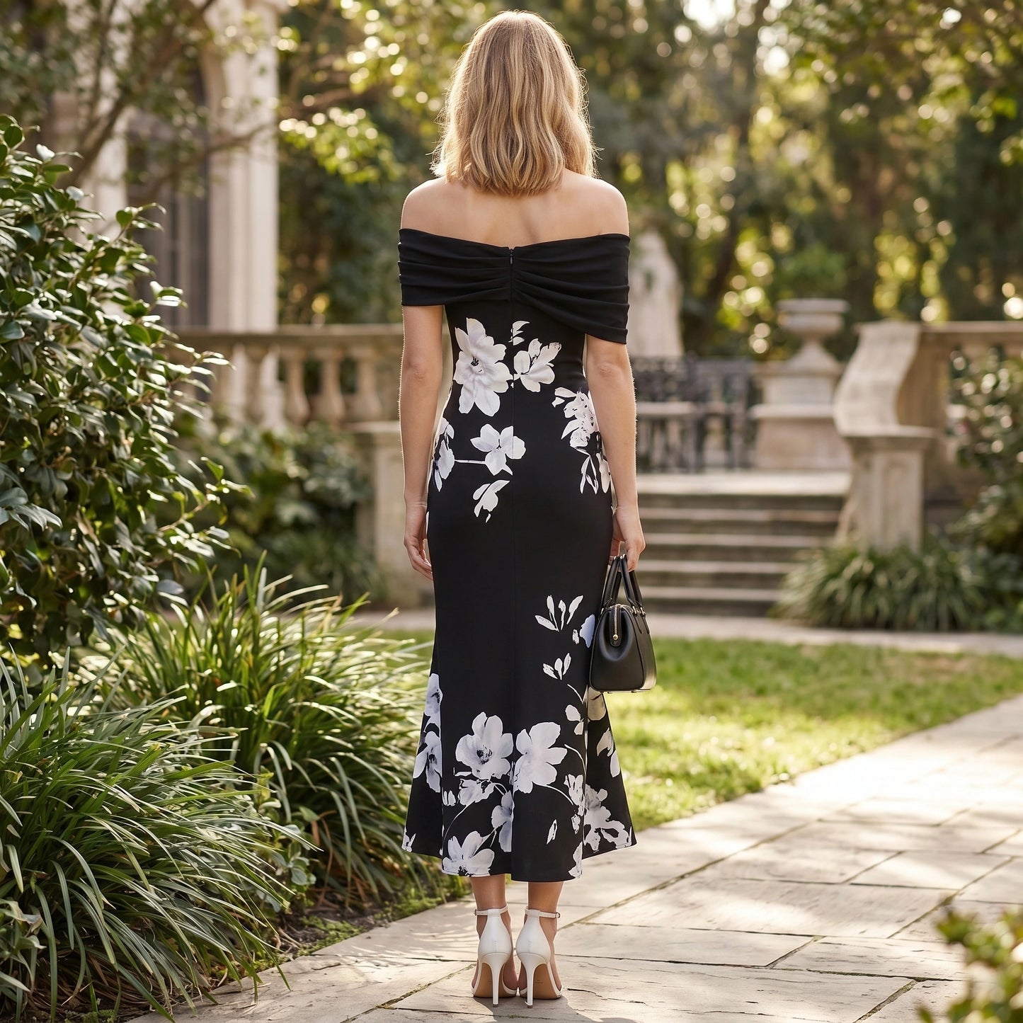 A model showcases the Womens Effortless Midi Dress in a soft pastel hue, styled with minimal accessories against a neutral backdrop.