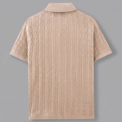 Close up of the men's textured lightweight casual shirt showing the intricate fabric weave and precise stitching against a neutral background.