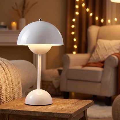 A model showcases the NordicBeam Scandinavian table lamp in a cozy living room setting, showing its sleek design and adjustable lighting features.