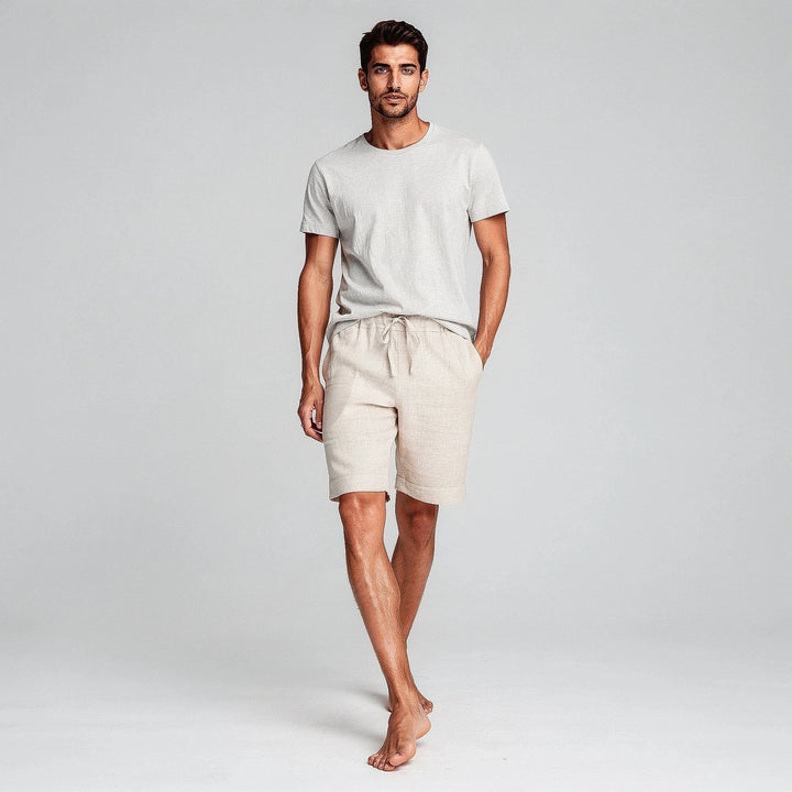 Lightweight casual shorts in a soft gray fabric, featuring an elastic waistband and pockets, view