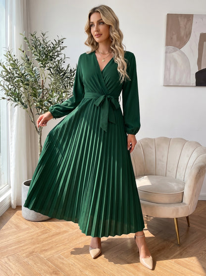 Close up view of the Womens Pleated Maxi Dress showing intricate pleating details and high quality stitching in a soft pastel hue against a neutral background.