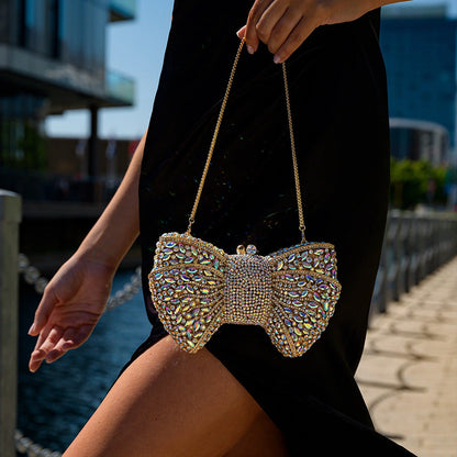 Elegant clutch bag in a soft fabric, featuring intricate detailing and sleek silhouette, shown — view 6 — view 6