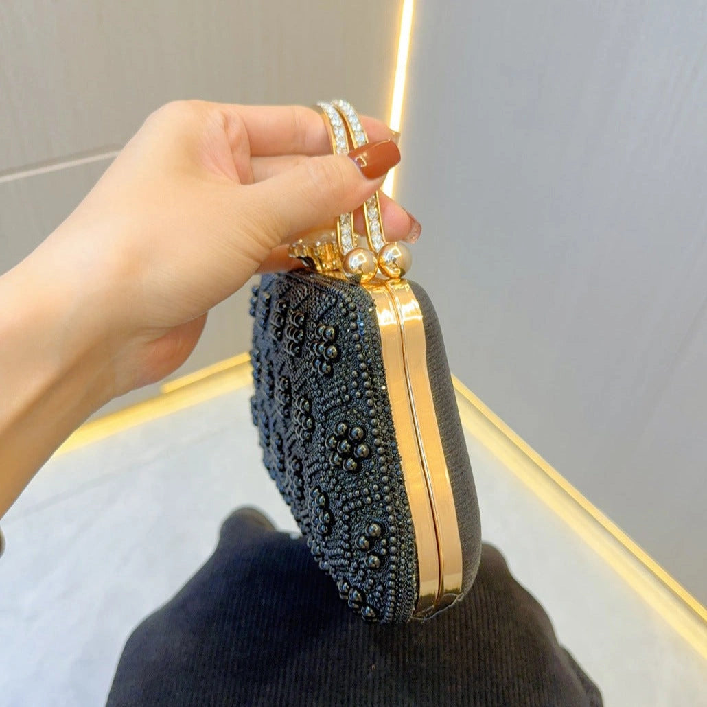 Elegant pearl clutch bag featuring a smooth finish and sleek design, showcasing subtle shimmer in natural light — view 10
