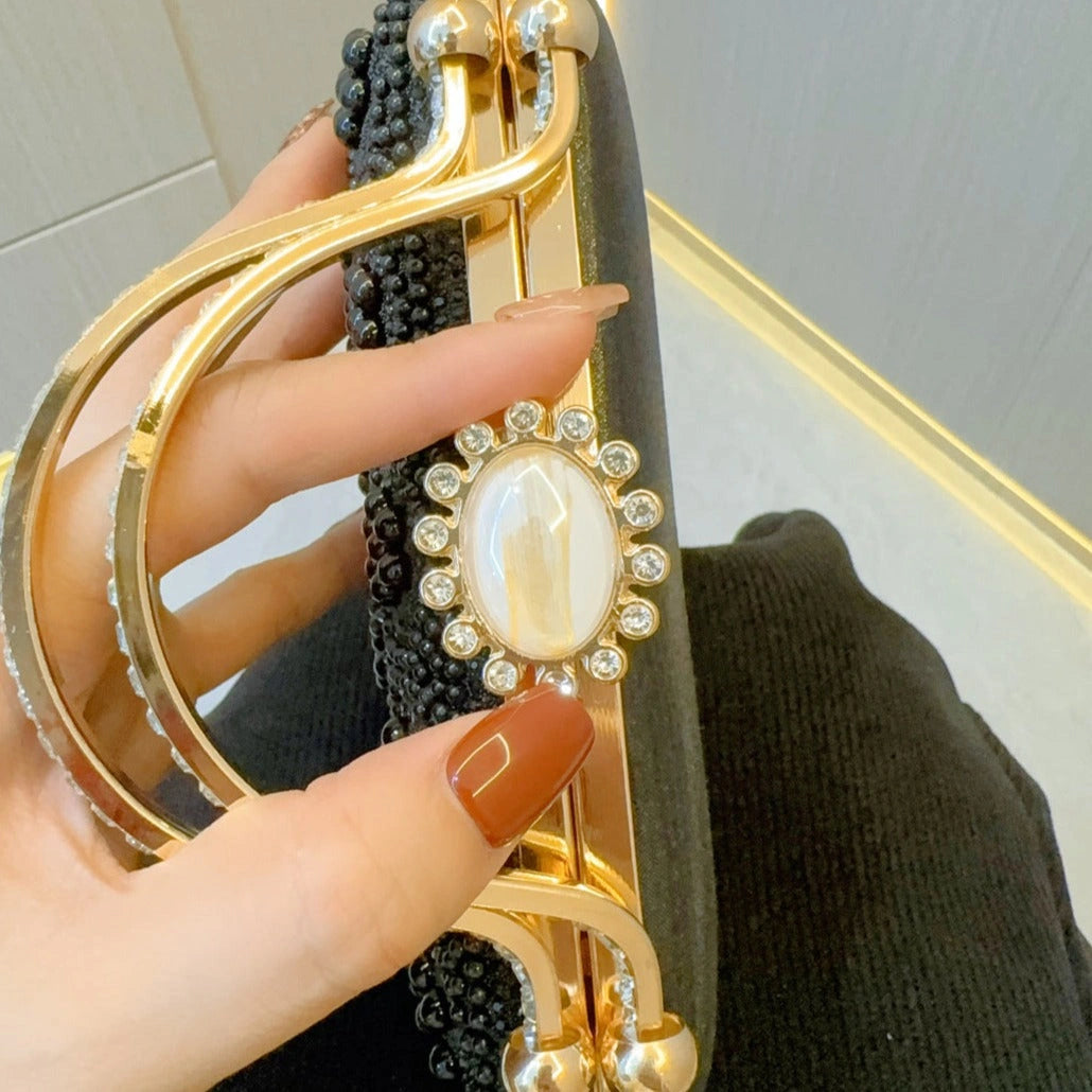 Elegant pearl clutch bag featuring a textured surface and sleek, compact design, showcasing soft white hue — view 6 — view 6