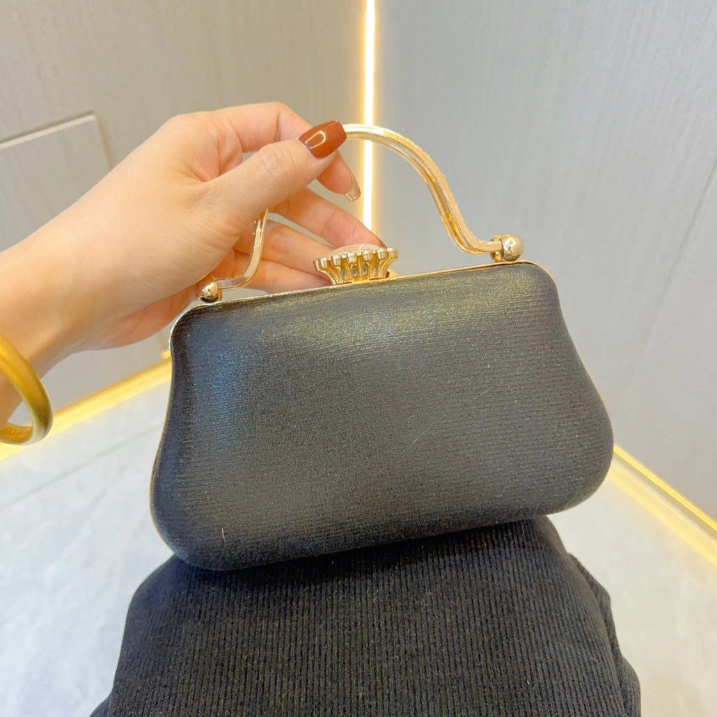 Elegant pearl clutch bag with a textured surface and sleek silhouette, showcasing subtle sheen, front view — 9 — view 9