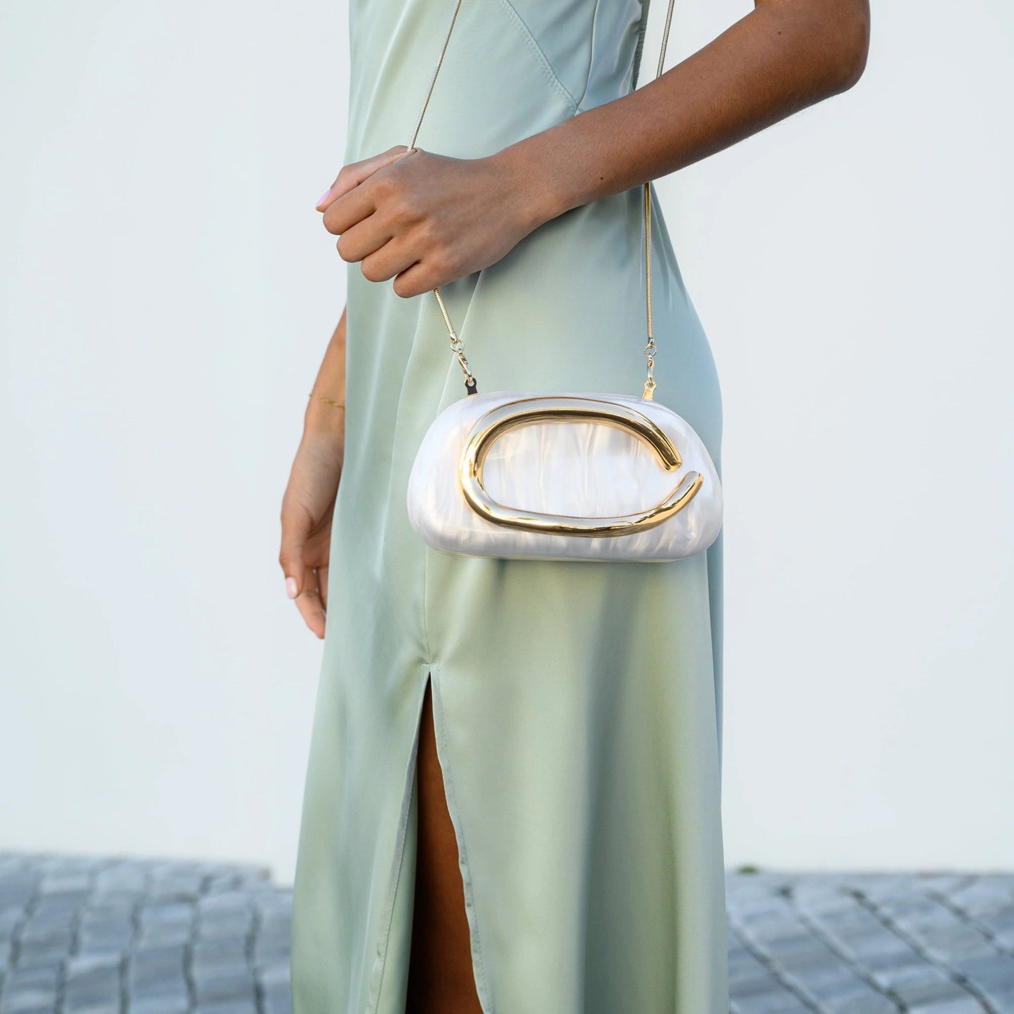 Elegant clutch bag in soft leather, featuring a sleek design with gold tone clasp and subtle textured finish — view — view 6