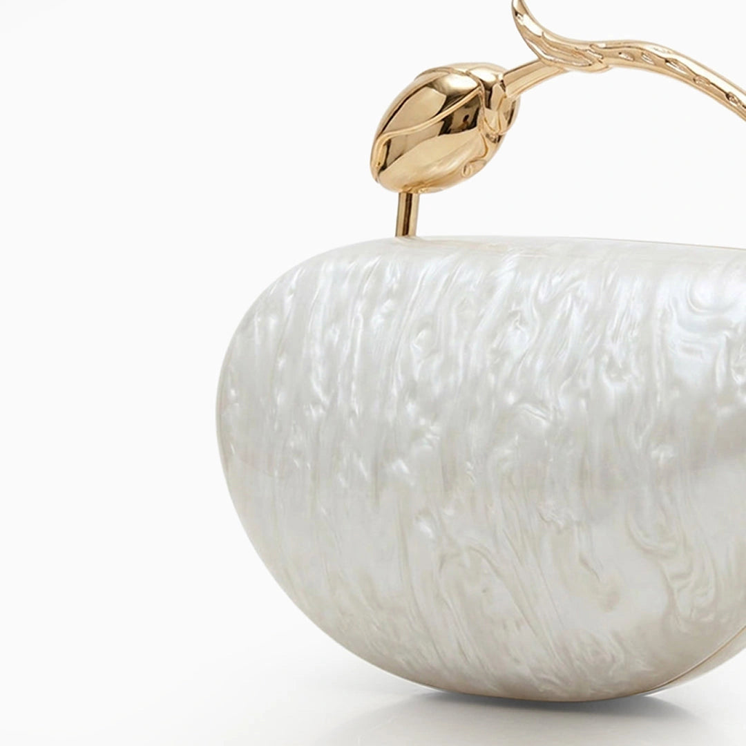 Translucent acrylic clutch bag in a soft pink hue, featuring sleek rectangular design and gold tone clasp closure — view 2