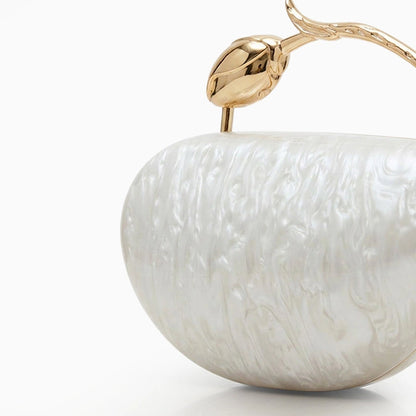 Translucent acrylic clutch bag in a soft pink hue, featuring sleek rectangular design and gold tone clasp closure — view 2