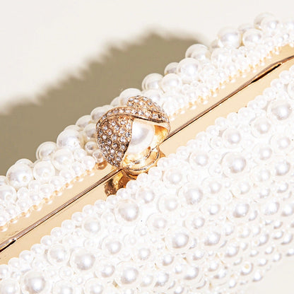 Elegant pearl clutch bag featuring a soft, textured exterior and sleek, compact design, showcasing delicate clasp — view 6