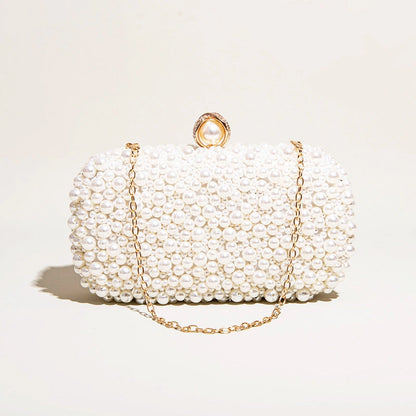 Elegant pearl clutch bag featuring a textured surface and sleek, compact design, shown from top down view — 9 — view 9