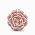 Elegant floral clutch bag featuring a vibrant pattern on soft fabric, top view showcasing the clasp closure
