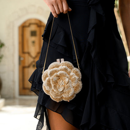 Elegant floral clutch bag featuring a vibrant pattern on soft fabric, top view with clasp closure — 12 — view 12
