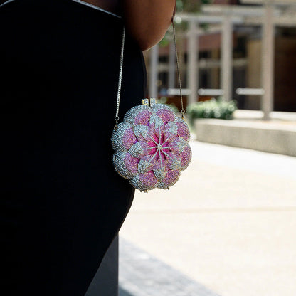 Elegant floral clutch bag featuring a vibrant pattern, soft fabric, and sleek, compact design — view 5 — view 5