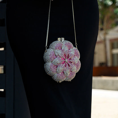 Elegant floral clutch bag featuring a vibrant pattern on soft fabric, showcasing top zipper closure and compact — view 7