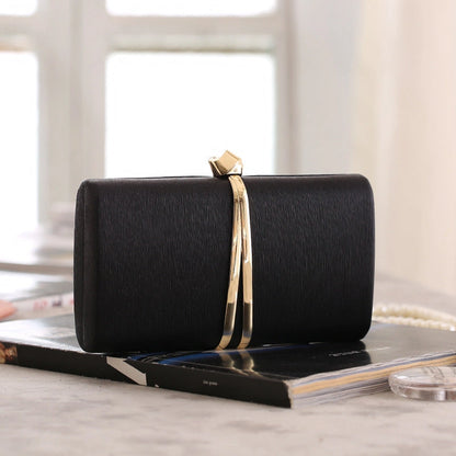 Elegant clutch bag in a soft cream color, featuring sleek design and subtle textured finish, top view — 12 — view 12