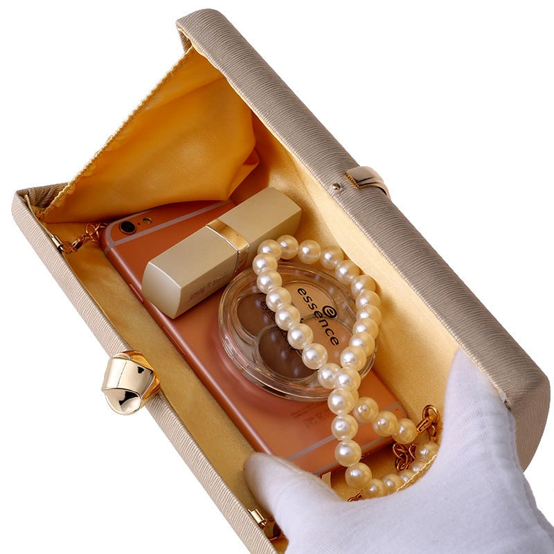 Elegant clutch bag in a soft fabric, featuring sleek silhouette and subtle metallic clasp, front view — 3 — view 3