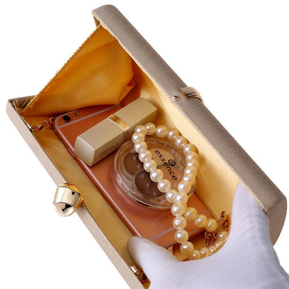 Elegant clutch bag in a soft fabric, featuring sleek silhouette and subtle metallic clasp, front view — 3 — view 3