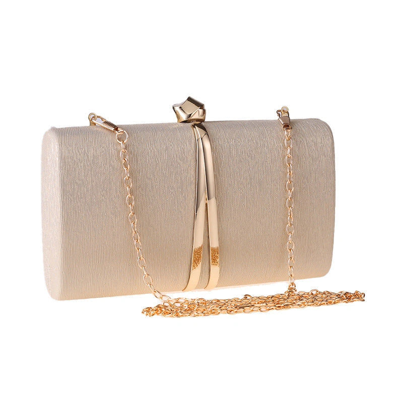 Elegant clutch bag in a soft cream color, featuring sleek design and subtle textured finish, top view — 7 — view 7