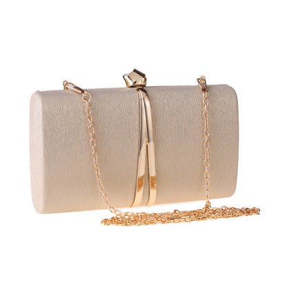 Elegant clutch bag in a soft cream color, featuring sleek design and subtle textured finish, top view — 7 — view 7