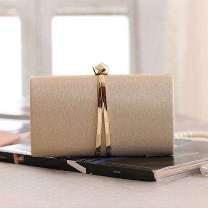 Elegant clutch bag in a soft cream color, featuring sleek design and subtle textured finish, front view — 8 — view 8