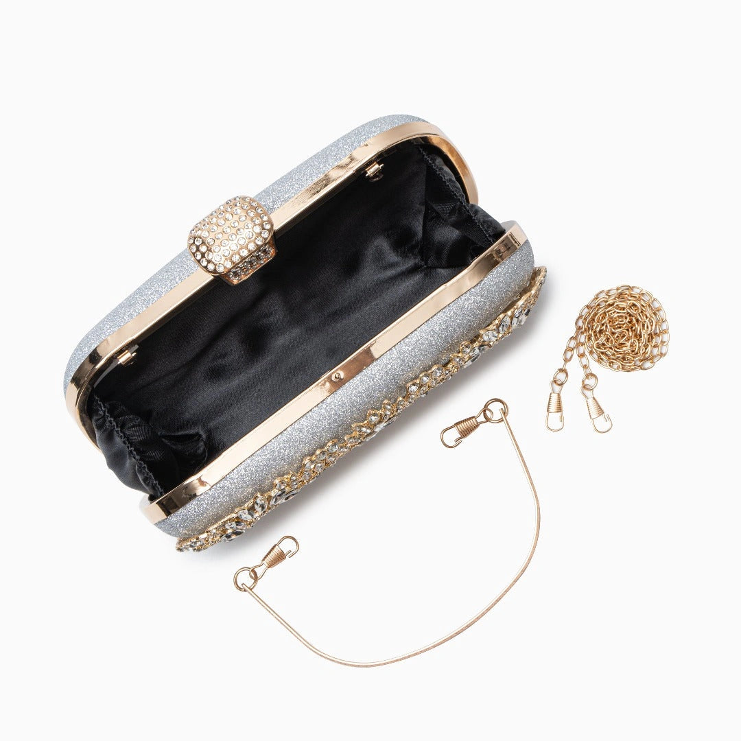 Elegant floral clutch bag featuring a vibrant pattern with gold tone clasp, shown from top down view — 13 — view 13