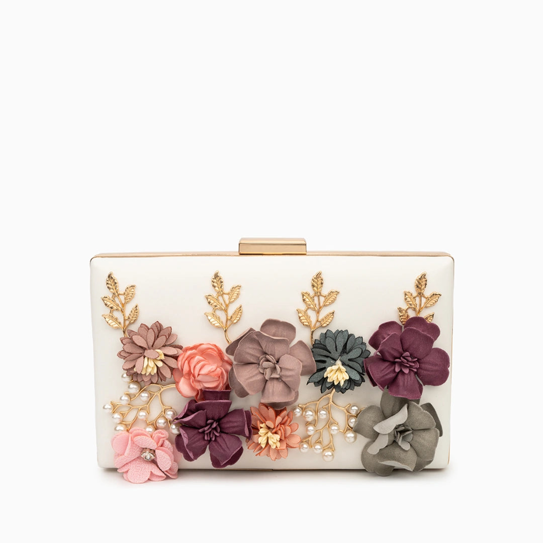 Scarlett red clutch bag featuring a floral design with textured finish, viewed