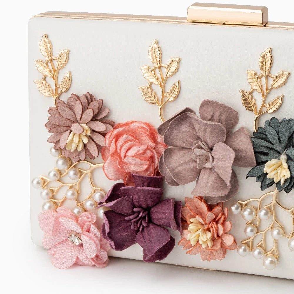 Scarlett red clutch bag featuring a floral design, soft fabric, and compact shape, angled view — 2 — view 2