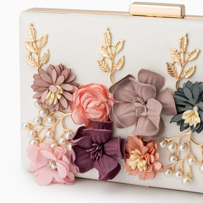 Scarlett red clutch bag featuring a floral design, soft fabric, and compact shape, angled view — 2 — view 2
